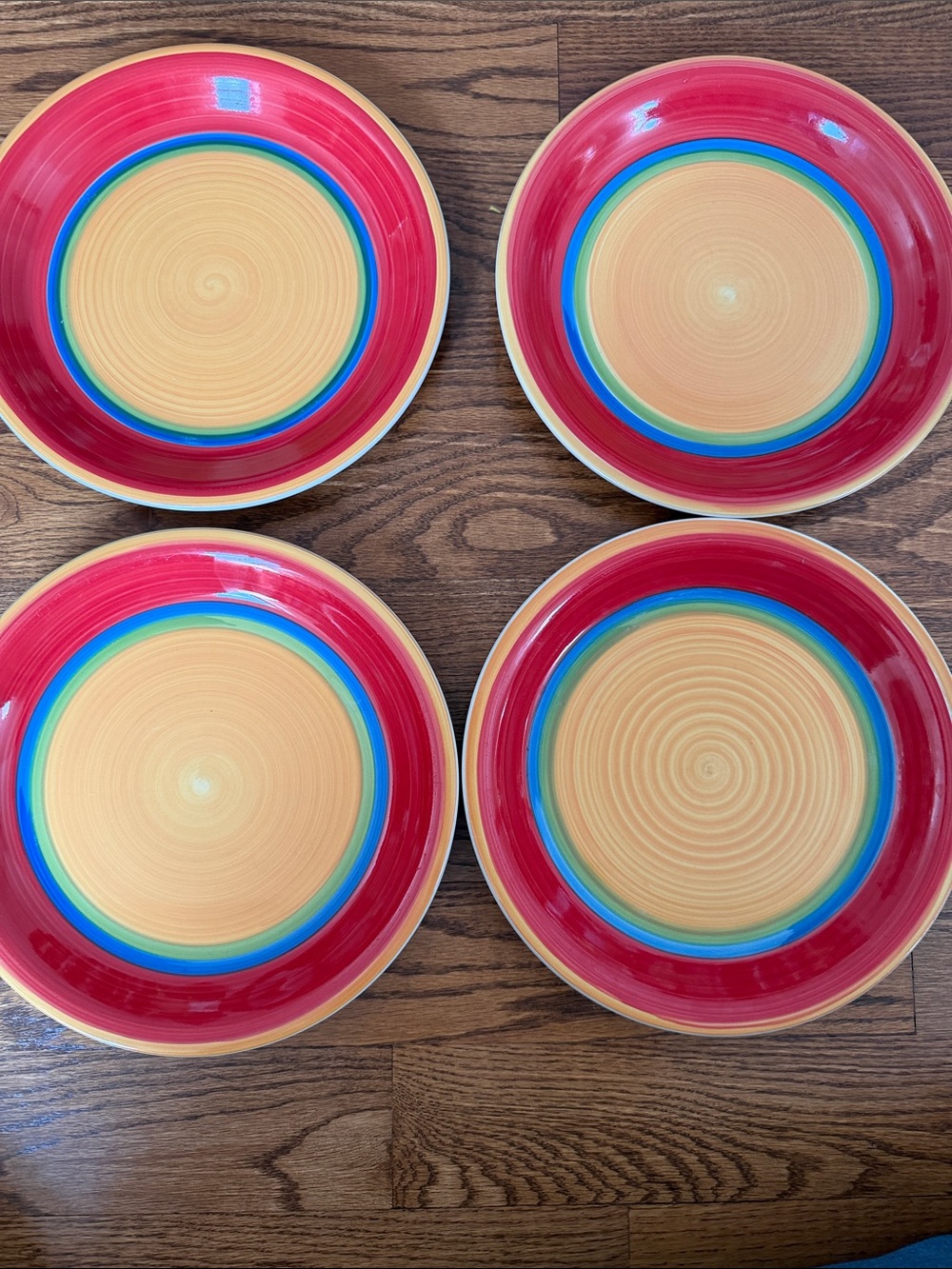 Royal Norfolk Mambo dinner plates - set of 4 - gold center red blue green rings